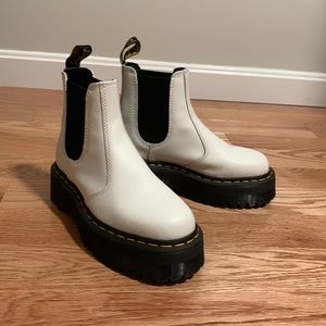 White platform Dr. Martins Chelsea boots.